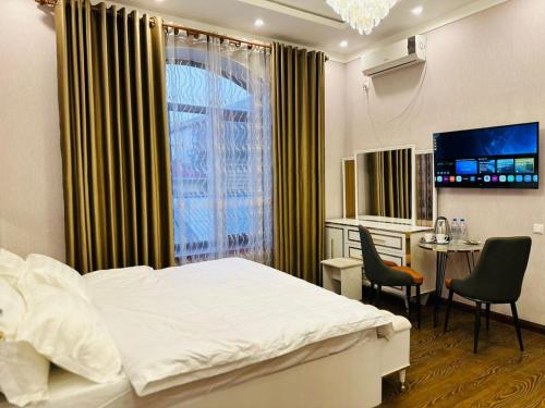 Postel nebo postele na pokoji v ubytování Soro Hotel