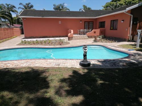 a swimming pool in front of a house at 850 Munro in Margate