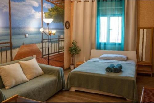 a bedroom with a bed and a couch at Arguinegin Gran Canaria Near the Beach with ocean view in Arguineguín