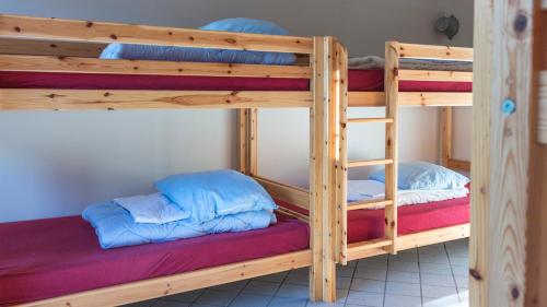 a couple of bunk beds in a room at Silkeborg Sø Camping Apartments in Silkeborg