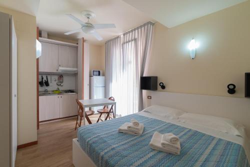 Giường trong phòng chung tại Residence Rosa