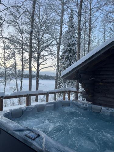 a jacuzzi tub with snow on the ground at Lapland Dream Destinations in Rovaniemi