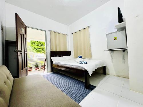 Giường trong phòng chung tại Olliz Huvila