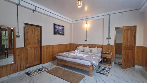 Postel nebo postele na pokoji v ubytování Red Cherry Homestay, Nokdara