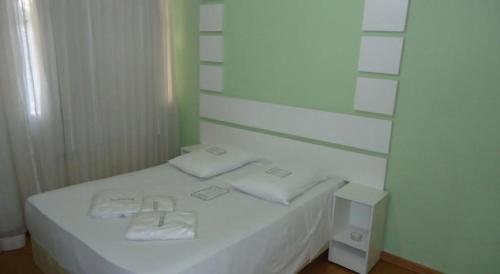 Ένα ή περισσότερα κρεβάτια σε δωμάτιο στο Hotel Turista