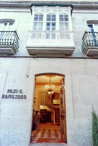 a building with a window and a stairway at Pazo Almuzara in Boborás