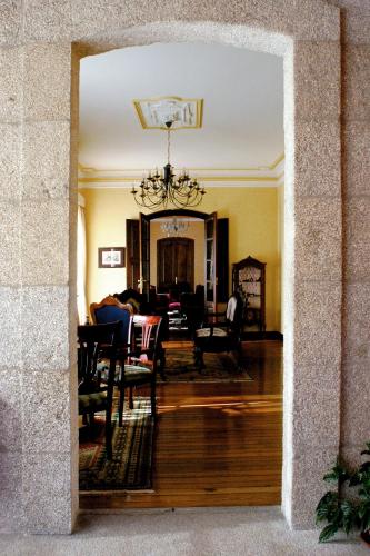 a view of a living room with a dining room at Pazo Almuzara in Boborás