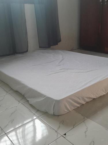 En eller flere senge i et værelse på Slow local living