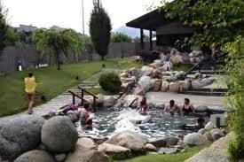a group of people in a pool of water at Pazo Almuzara in Boborás