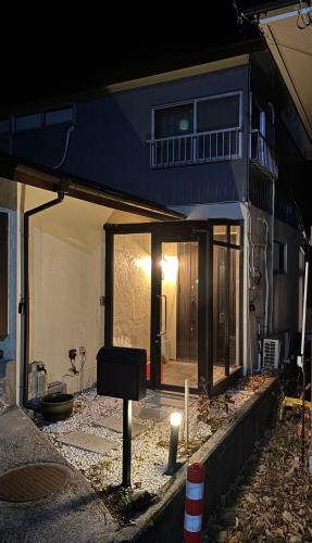 a house being remodeled with the front door open at Seikyo 草津温泉 in Kusatsu