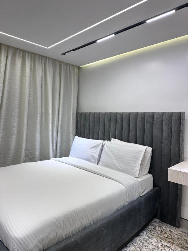 En eller flere senge i et værelse på Executive studio