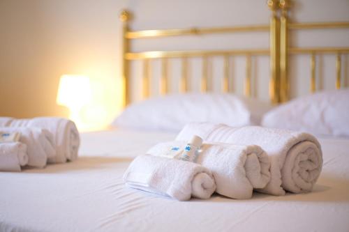 Ένα ή περισσότερα κρεβάτια σε δωμάτιο στο Rossi Boutique Apartment