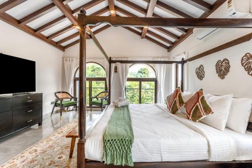 En eller flere senge i et værelse på Casa Del Mundo