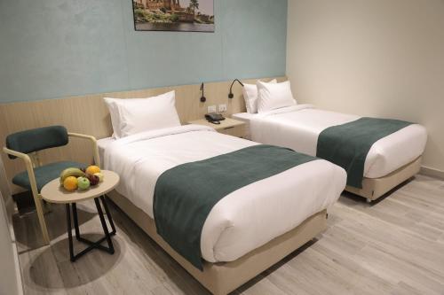 Giường trong phòng chung tại Solpyramid Hotel