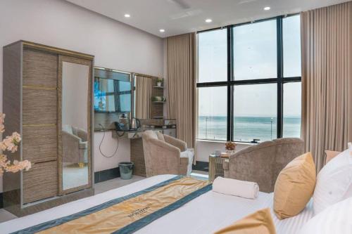 Postel nebo postele na pokoji v ubytování Horizon Aden