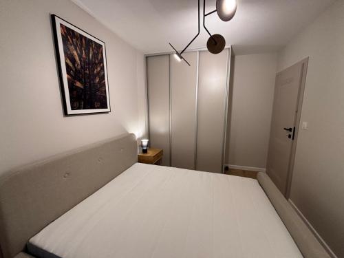 Postel nebo postele na pokoji v ubytování Eden Apartment