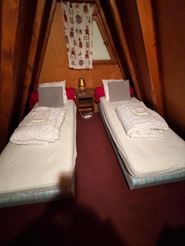 Ein Bett oder Betten in einem Zimmer der Unterkunft Chalet de montagne