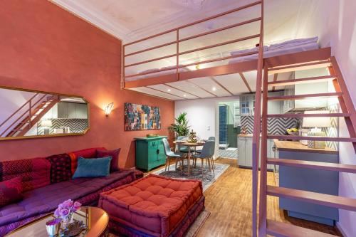 a living room with a couch and a loft bed at FABEL Apartments am Hbf in Berlin