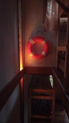 a small room with a red object on the wall at La tinyhouse del bosque in Mar Azul