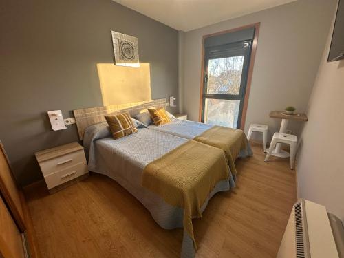 En eller flere senge i et værelse på Pensión Villa Mayer - Grupo Arcanos