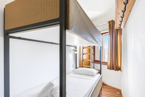 En eller flere senge i et værelse på Hostdomus-Star Apartment