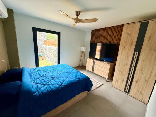 En eller flere senge i et værelse på L'Etoile Bleu T2 Grand Anse