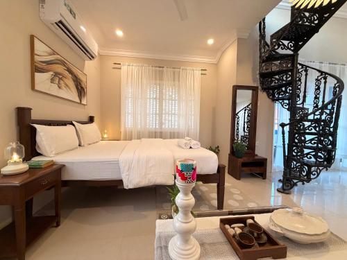 En eller flere senge i et værelse på Villa Marina -By The Beach Goa