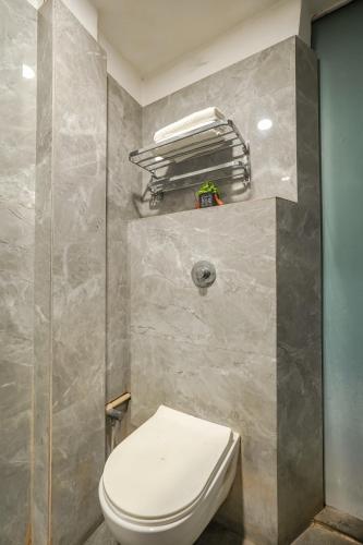 a bathroom with a white toilet in a room at Hotel Kashmir inn Just 2 Min walk from Golden Temple in Amritsar