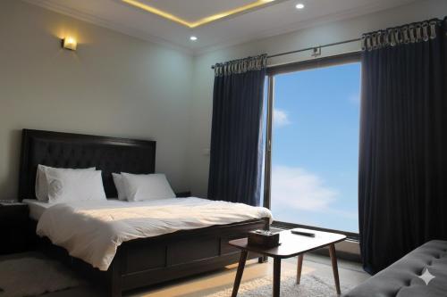 En eller flere senge i et værelse på The Atelier G-13