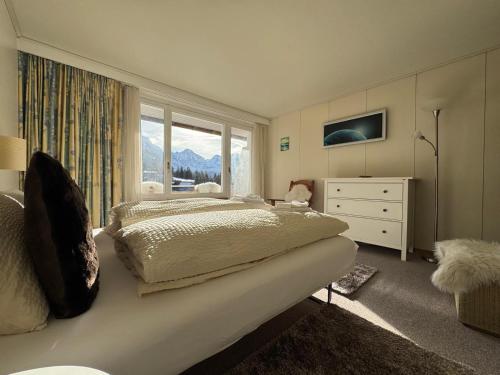 Ένα ή περισσότερα κρεβάτια σε δωμάτιο στο Apartment with great view at Residence Brunner