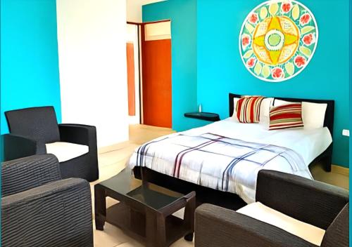 En eller flere senge i et værelse på La Estancia