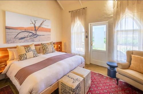 En eller flere senge i et værelse på The Schoolhouse at Meulplaas