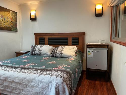 Postel nebo postele na pokoji v ubytování Nubes Hotel