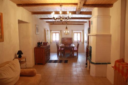 a living room with a table and a dining room at Bruggerhaus in Schöder