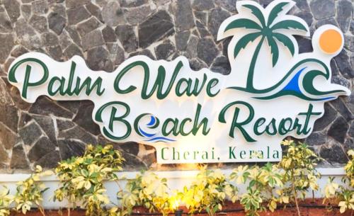 een bord met de tekst Palm Wave Beach Resort bij Palm Wave Beach Resort in Cochin