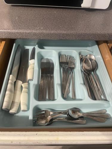 a tray filled with utensils in a drawer at 1 Bed Victorian flat Sleeps 4 - Garden & Patio in London