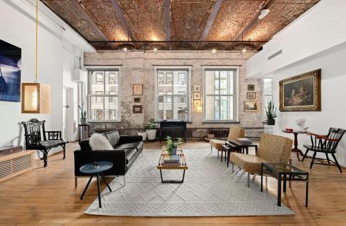 a living room with a couch and chairs at Sun-Filled Luxury Historic 2 Bedrooms apto in New York
