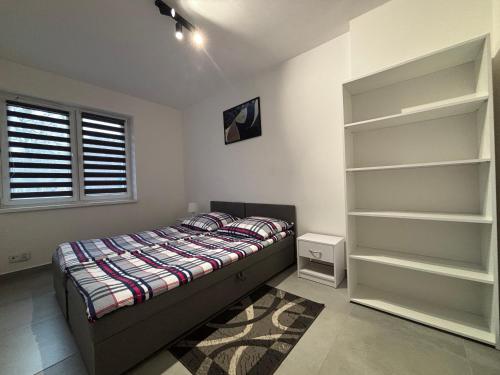 Postel nebo postele na pokoji v ubytování Apartamenty Przy Rynku Gąsawa/Biskupin