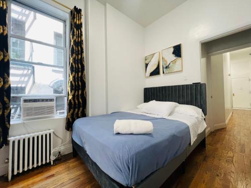 Postel nebo postele na pokoji v ubytování Manhattan Central at Times Square