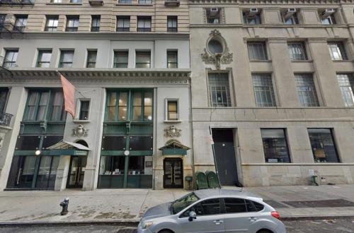 a silver car parked in front of a building at Sun-Filled Luxury Historic 2 Bedrooms apto in New York