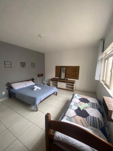 En eller flere senge i et værelse på La Brisa House