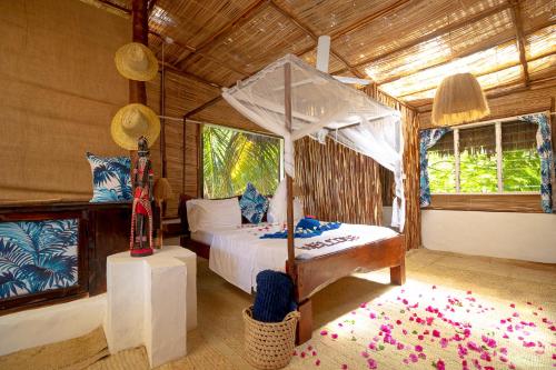 Postel nebo postele na pokoji v ubytování Richland makuti villas watamu