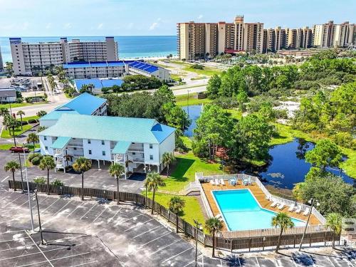 an aerial view of a resort with a swimming pool at Latitude 107 2 bedroom walk to beach in Orange Beach