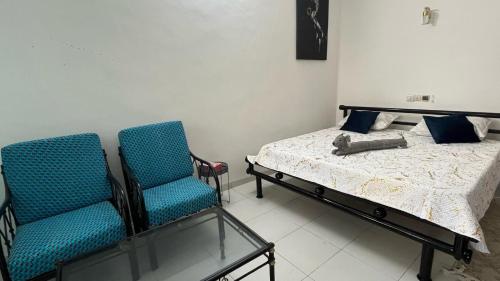 En eller flere senge i et værelse på Les Residences Belani - Cadjehoun, Cotonou