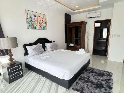 En eller flere senge i et værelse på Paradise Big Villa Samui 5 bed