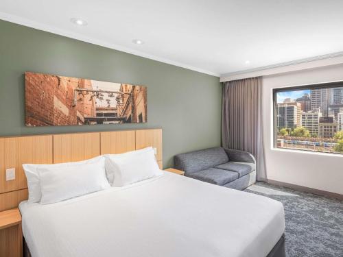 Кровать или кровати в номере Mercure Melbourne Southbank