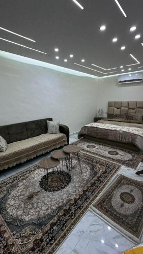 a living room with a couch and a bed at Nadina Bedouin home in Petra