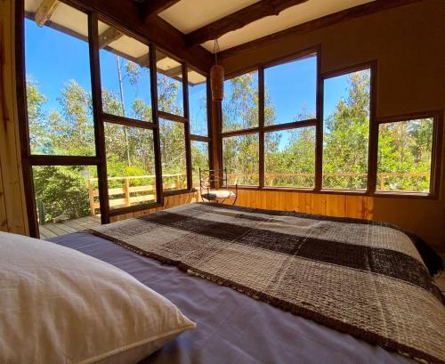 En eller flere senge i et værelse på Mankay House, Cobquecura