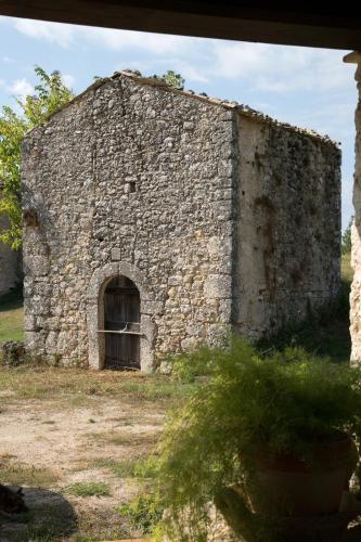an old stone building with an open door at Agriturismo Le Faeta in Arpino