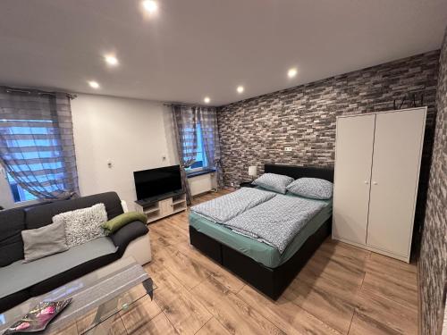 En eller flere senge i et værelse på Ferienwohnung AyNa 2, direkt an der Schweizer Grenze